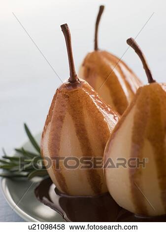 Pear Poached with Rosemary and a Chocolate sauce View Large Photo Image Stock Photo - Pear Poached with Rosemary and a Chocolate sauce. Fotosearch