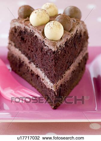 Stock Image - Slice of Chocolate Malteser Cake. Fotosearch