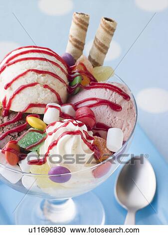 Stock Image - Trio of Ice Cream and Sweet Sundae. Fotosearch