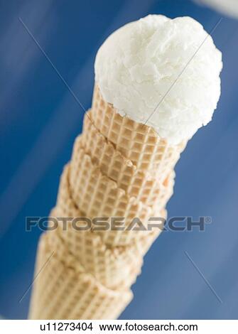 Picture - Vanilla Ice Cream Scoop in a Wafer Cone. Fotosearch