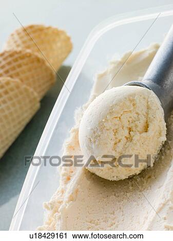 Stock Image - Vanilla Ice Cream with Cones and a Scoop. Fotosearch