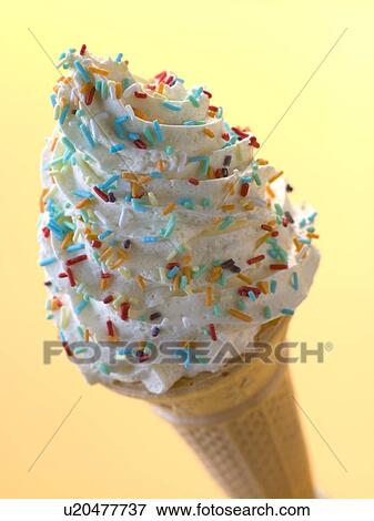 Stock Photo - Whipped Ice Cream Cone with Candy Sprinkles. Fotosearch