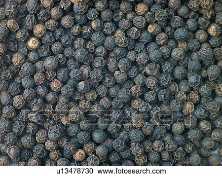 Stock Image - Black pepper corns. Fotosearch