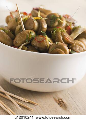 Stock Image - Championes al Ajillo- Chilli marinated Mushrooms. Fotosearch