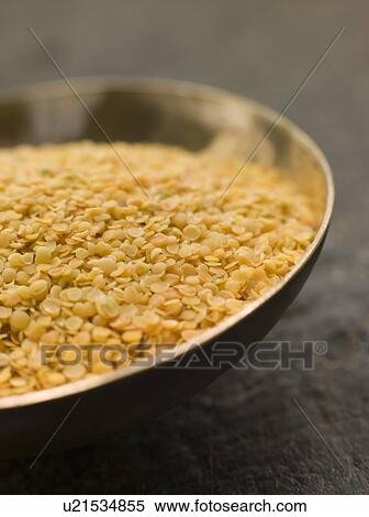 Stock Photography - Dish of Split Yellow Mustard Seeds. Fotosearch