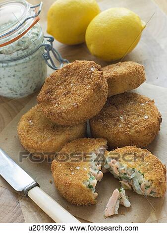 Stock Photography - Cod and Salmon Fish Cakes with Tartar Sauce. Fotosearch