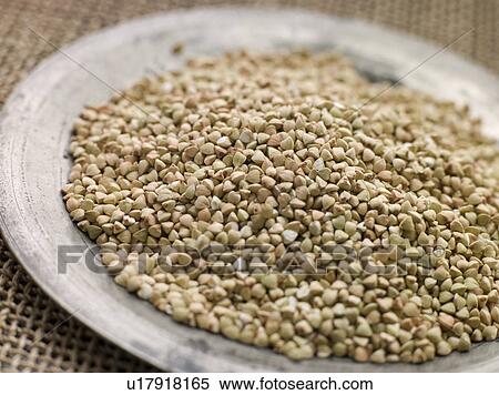 Stock Photography - Grains of Quinoa on a Pewter Plate. Fotosearch