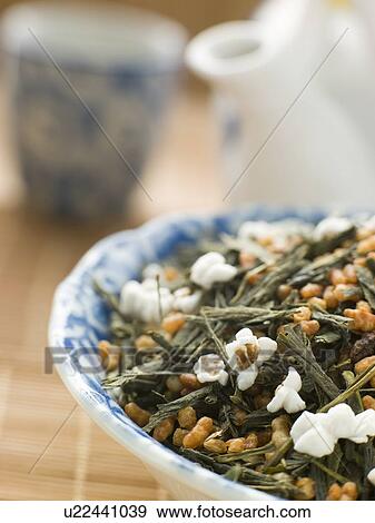 Stock Photo - Green Tea Leaves with Brown Rice. Fotosearch