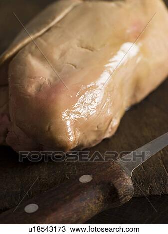 Stock Image - Lobe of Foie Gras on a Chopping Board. Fotosearch