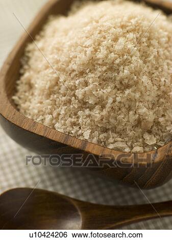Stock Photograph - Rice in wooden bowl. Fotosearch