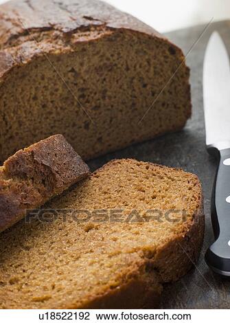 Stock Image - Sliced Loaf of Parkin. Fotosearch
