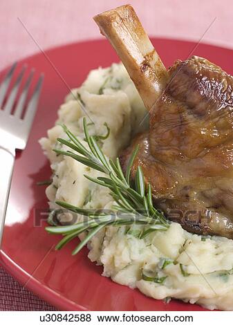 Slow Roasted Shank of Spring Lamb with Champ View Large Photo Image Stock Photo - Slow Roasted Shank of Spring Lamb with Champ. Fotosearch
