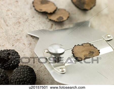 Stock Image - Truffle and slicer. Fotosearch