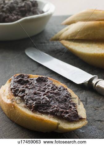 Black Olive Tapenade with toasted baguette View Large Photo Image Stock Image - Black Olive Tapenade with toasted baguette. Fotosearch