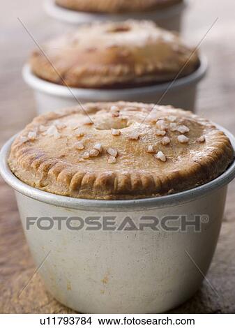 Picture - Black Truffled Pork and Pistachio Pies. Fotosearch