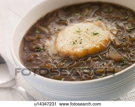 Stock Image - Bowl of French Onion Soup with a Goats Cheese Crouton. Fotosearch