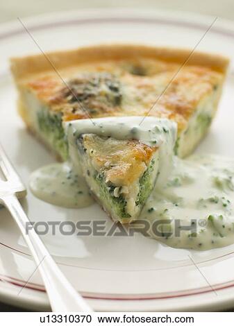 Stock Image - Broccoli and Roquefort Quiche with Broccoli sauce. Fotosearch