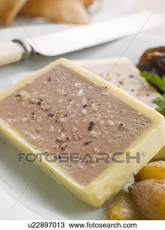 Stock Image - Chicken Liver and Foie Gras Parfait with Caramelised Shallots and Melba Toast. Fotosearch