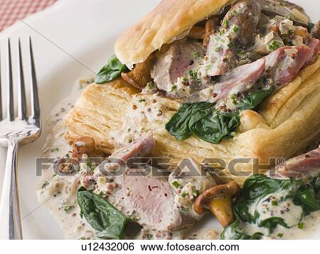 Chicken Livers Spinach and Girolle Mushrooms served in a Vol-au-Vent case with Grain Mustard Sauce View Large Photo Image Stock Photograph - Chicken Livers Spinach and Girolle Mushrooms served in a Vol-au-Vent case with Grain Mustard Sauce. Fotosearch