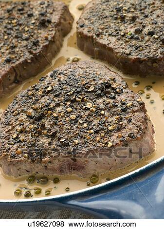 Stock Photo - Filet Mignon au Poirve' in a saut pan. Fotosearch