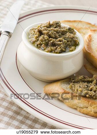 Green Olive Tapenade with toasted baguette View Large Photo Image Stock Photo - Green Olive Tapenade with toasted baguette. Fotosearch