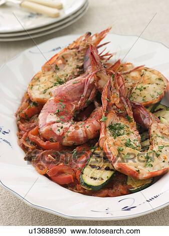 Grilled Tiger Prawns on Piperade with Grilled Courgettes View Large Photo Image Stock Image - Grilled Tiger Prawns on Piperade with Grilled Courgettes. Fotosearch