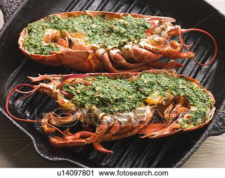 Stock Image - Lobster Half Grilled with Garlic and Parsley Butter. Fotosearch
