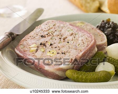 Stock Image - Pate Campagne with Cornichons and Confit Onions. Fotosearch