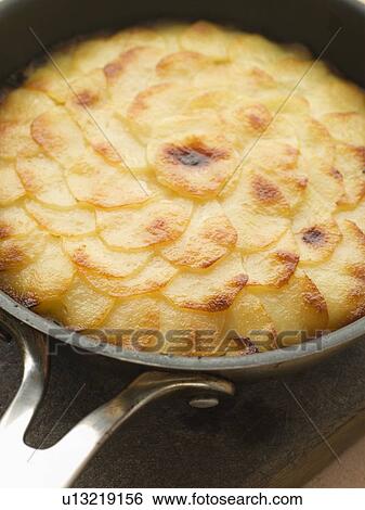 Stock Photograph - Pomme Anna Cake in a Frying Pan. Fotosearch