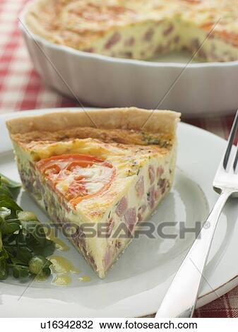 Stock Image - Quiche Lorraine with Watercress salad and Vinaigrette. Fotosearch