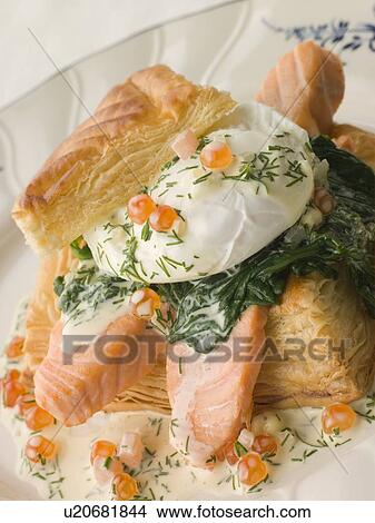 Picture - Seared Salmon Spinach and a Poached Egg in a Vol-au-Vent Case with a Dill and Keta Caviar Sauce. Fotosearch