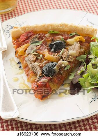 Slice of Provencale Tart with Dressed salad View Large Photo Image Stock Photo - Slice of Provencale Tart with Dressed salad. Fotosearch