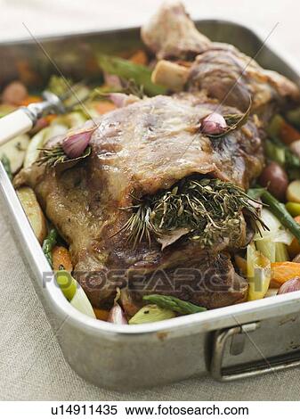 Slow Roasted Shoulder of Lamb Stuffed with Herbs de Provence Roasted Vegetables View Large Photo Image Stock Photography - Slow Roasted Shoulder of Lamb Stuffed with Herbs de Provence Roasted Vegetables. Fotosearch