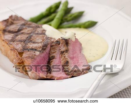 Stock Photography - Steak Bearnaise with Asparagus Spears. Fotosearch