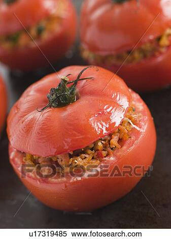 Stock Photography - Stuffed Beef Tomato on a Baking Sheet. Fotosearch