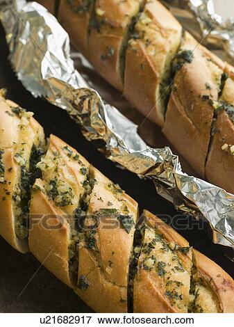 Two Garlic Buttered French Sticks View Large Photo Image Stock Photo - Two Garlic Buttered French Sticks. Fotosearch