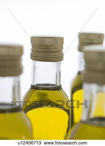 Stock Image - Bottles of Virgin Olive Oil. Fotosearch