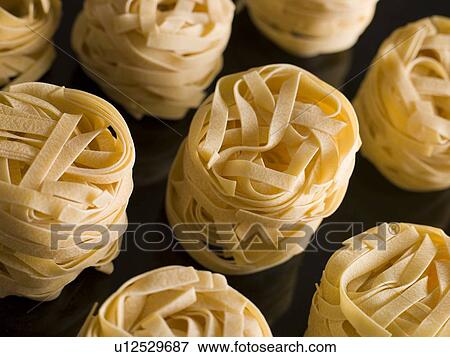 Dried Tagliatelle Nests View Large Photo Image Stock Photo - Dried Tagliatelle Nests. Fotosearch
