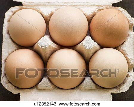 Stock Image - Fresh eggs in box. Fotosearch