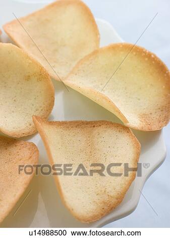 Stock Image - Tuile Biscuits on a Petit Four Stand. Fotosearch