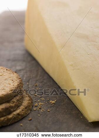 Wedge of Mature Cheddar with Oatmeal Biscuits View Large Photo Image Stock Photography - Wedge of Mature Cheddar with Oatmeal Biscuits. Fotosearch