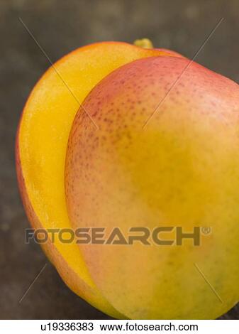 Stock Image - Halved mango. Fotosearch