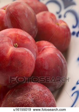 Stock Photo - Plums in dish. Fotosearch