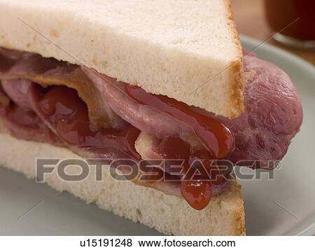 Stock Photo - Bacon Sandwich on White Bread with Tomato Ketchup. Fotosearch