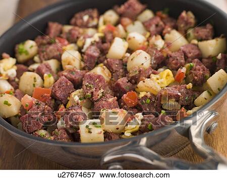 Stock Photo - Corned Beef Hash in a Frying Pan. Fotosearch