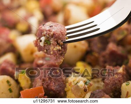 Stock Image - Corned Beef Hash on a Fork. Fotosearch