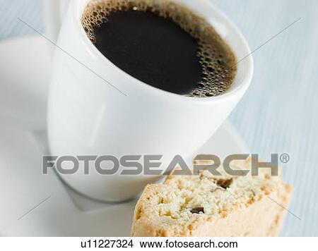 Picture - Cup of Espresso Coffee with Hazelnut Biscotti. Fotosearch