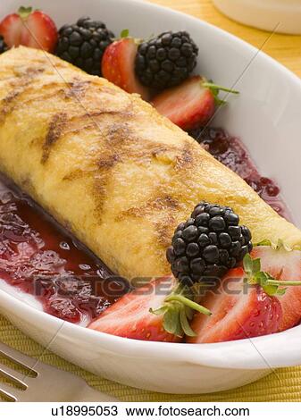 Stock Image - Jam Omelette with Berries. Fotosearch