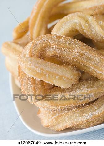 Plate of Churros View Large Photo Image Stock Photo - Plate of Churros. Fotosearch