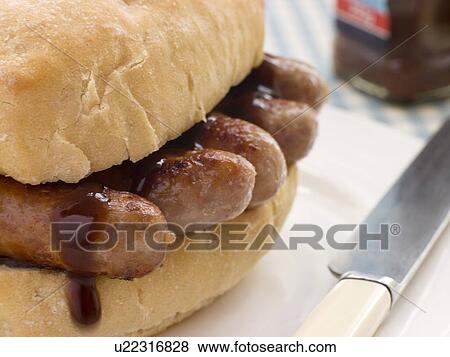 Pork Sausage Crusty Roll with Brown Sauce View Large Photo Image Stock Photo - Pork Sausage Crusty Roll with Brown Sauce. Fotosearch